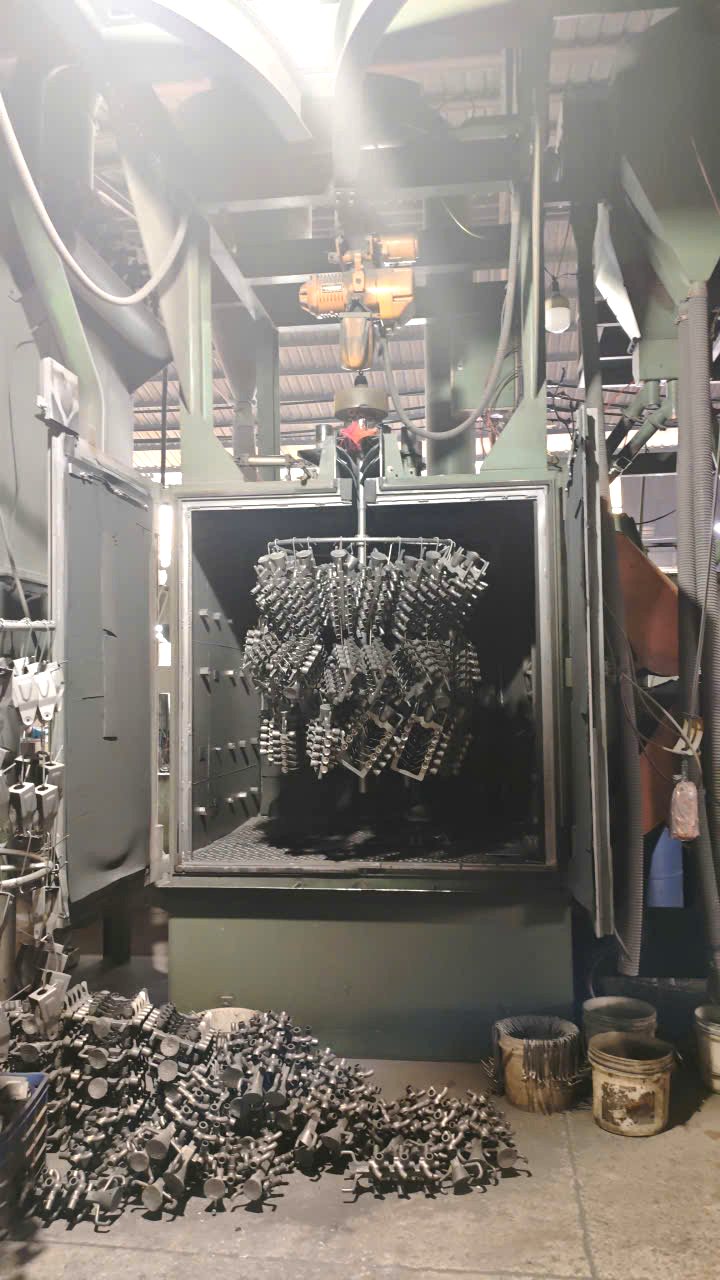 Castings loaded on the shot blasting hanger